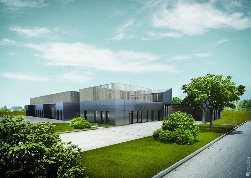 Bâtiment moderne avec façade en verre, entouré d'arbres et de buissons, situé près d'une route.